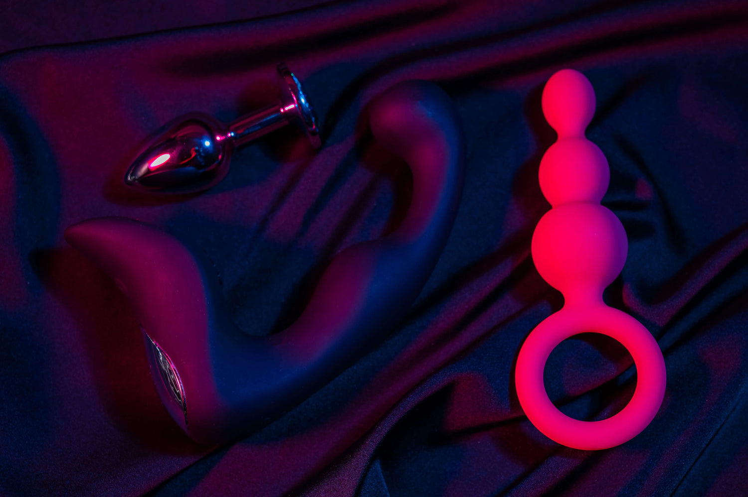 anal beads , prostate massager and a butt plug on a black background - Flutters.ie